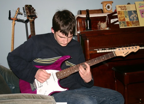 David playing his guitar